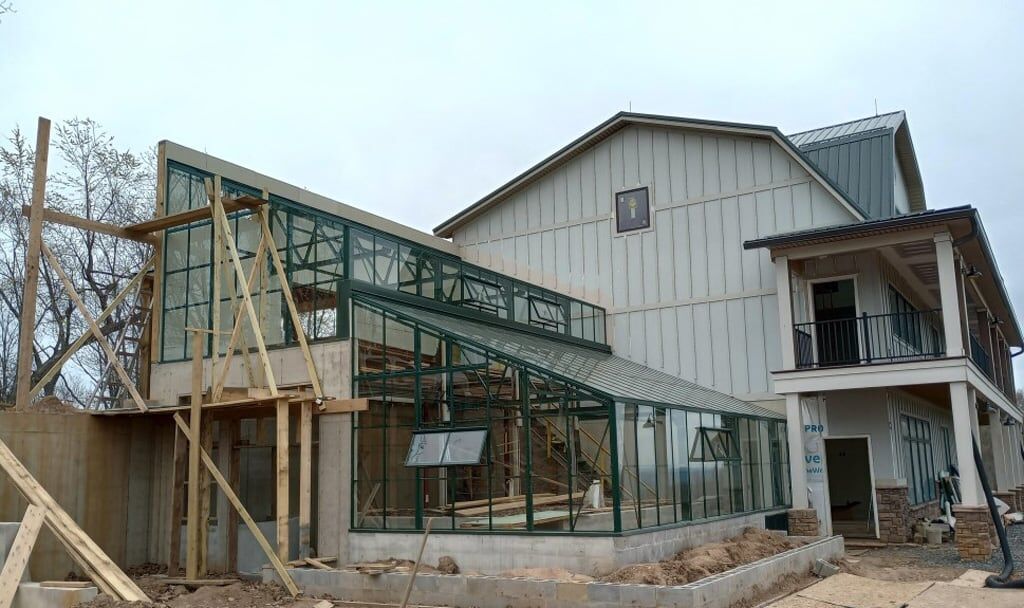Photo of Completed Twin TLT 14×30 SG6mm Greenhouses